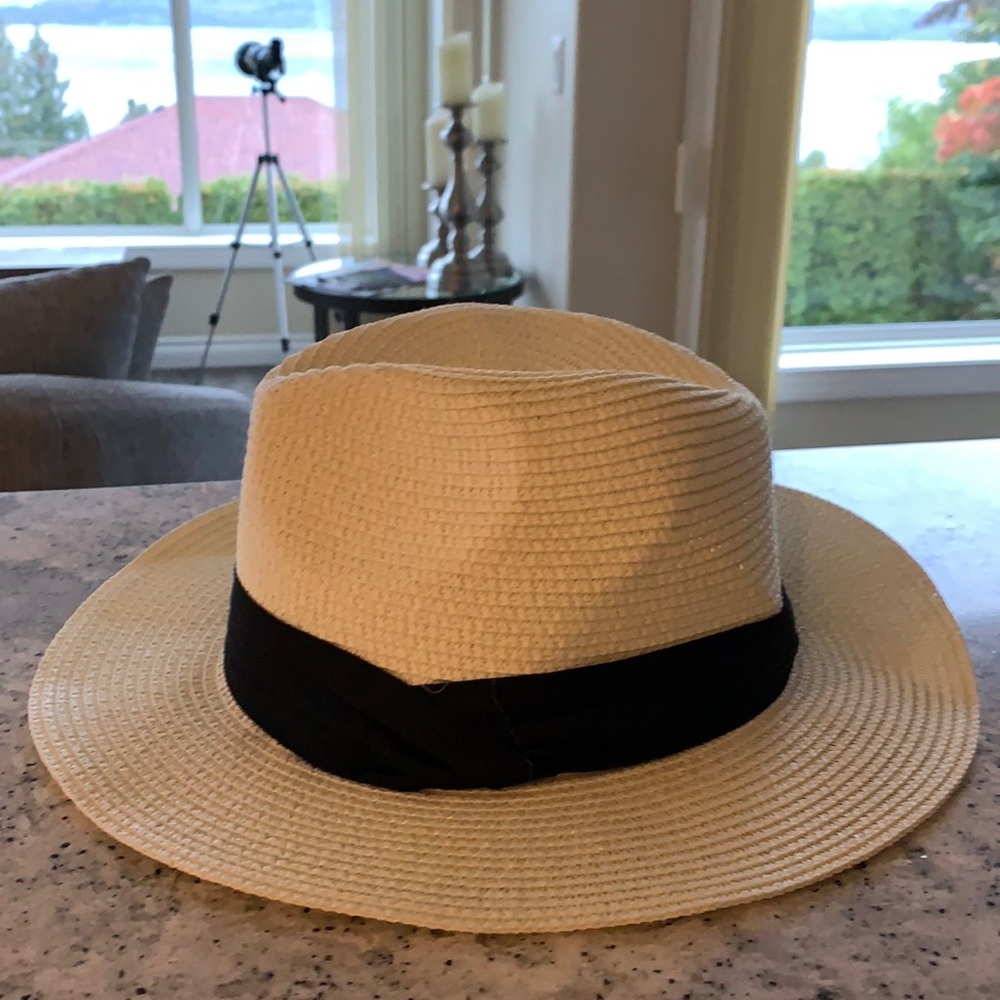 Women’s hat . New. Never worn. No tags . Cream in colour with a hint of silver